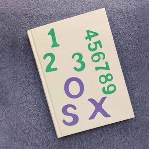 Close-up of colorful magnetic letters and numbers stickers on a book for scrapbooking