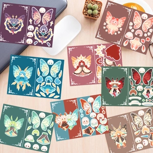 Set of 8 colorful DIY butterfly character stickers on a wooden desk with a coffee mug