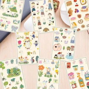 Artistic collage of hand-drawn Korean cartoon stickers on a light wooden desk