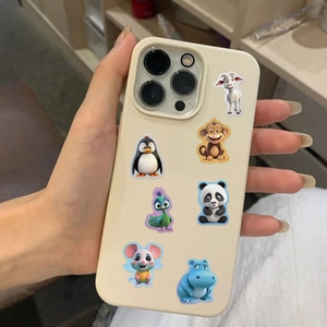 Close-up of cream phone case featuring cute colorful cartoon animal patterns on back