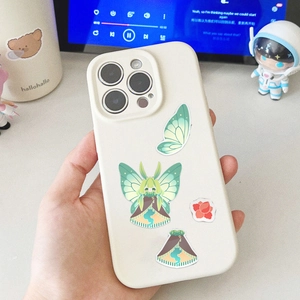Close-up of DIY butterfly fairy stickers on a white iPhone case with a cute anime aesthetic
