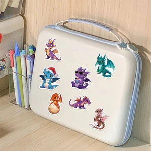 Detail showing 7 cute cartoon dragon stickers on a white pouch with a macro focus