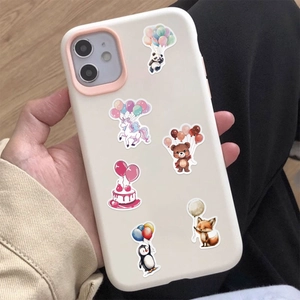 Close-up of cute cartoon animal balloon stickers applied on a white smartphone case