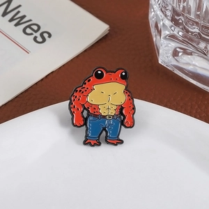 Creative cartoon muscular red frog enamel brooch with blue jeans on a white plate