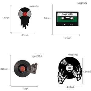 Set of 4 vintage music enamel pins including melting vinyl record and cassette player