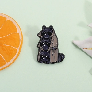 Creative enamel brooch featuring three stacked raccoons in a classic khaki trench coat