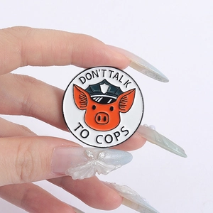 Cute cartoon pig sheriff enamel pin badge featuring Don't Talk to Cops slogan