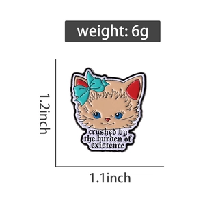 Detailed view of enamel cat badge showing the 1.1x1.2 inch dimensions and product weight