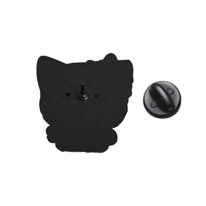 Detail view of the black metal back of enamel pin with rubber clutch on white backdrop