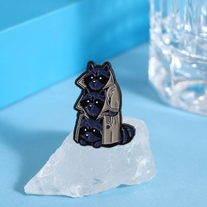 Close-up of cute cartoon raccoon alloy enamel brooch standing on white crystal stone