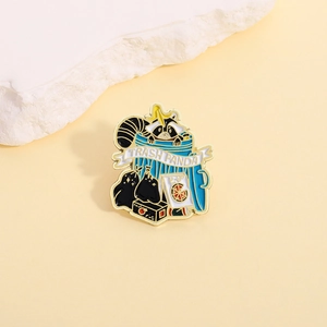 Detail of trash panda enamel pin with raccoon in blue bin on white stone stand