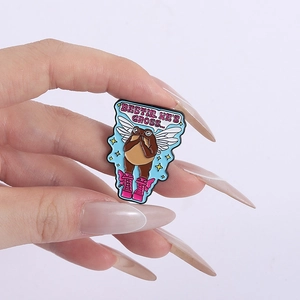 Cartoon enamel pin of a winged creature in boots with funny slogan on white background