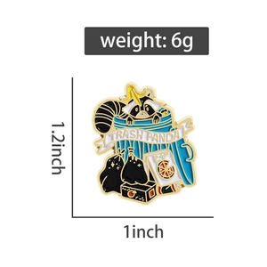 Detail view of cartoon raccoon enamel pin with Trash Panda text and 1.2x1 inch size dimensions