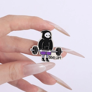 Detailed view of skull reaper weightlifting enamel pin with Dead Lift text design