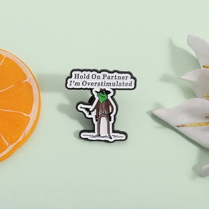 Cartoon frog cowboy enamel pin with Hold On Partner I'm Overstimulated quote for backpacks