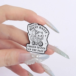 Cartoon enamel pin featuring a cat riding a bicycle with 'Born to Dilly Dally' text