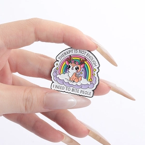 Detail of deer enamel pin with rainbow and text 'Therapy is not enough I need to bite people'