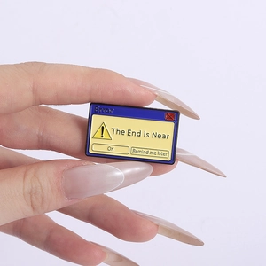Retro computer error message enamel pin featuring 'The End is Near' text and blue border