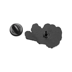 Detail view of the black rubber clutch and metal pin backing for enamel brooches