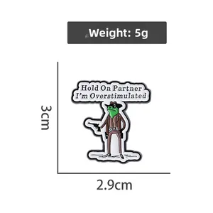 Cartoon cowboy frog enamel pin detail with size measurements and funny text