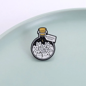 Cute cartoon cat bottle enamel pin badge featuring Happiness Potion design on ceramic tray