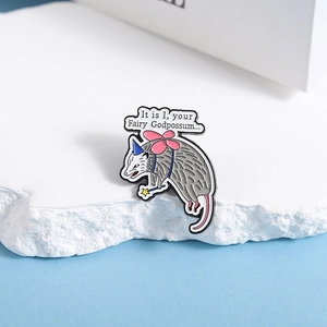 Funny animal possum enamel pin badge with fairy wings and magic wand on white stone