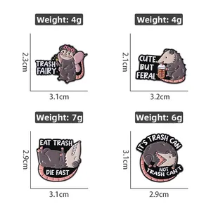 Detailed view of four funny opossum enamel pins with specific size and weight labels