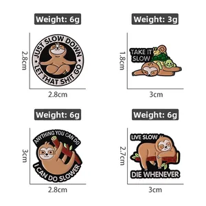 Detail view of four cute sloth enamel pins showing various poses and precise sizes