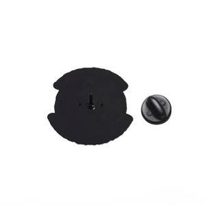 Detail of the black matte enamel pin back with secure rubber clutch and anti-rotation studs