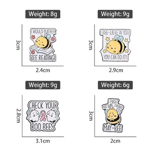 Set of four creative cartoon bee enamel pins with motivational and punny English designs