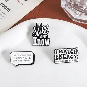 Minimalist enamel slogan brooches including The Deadline For Complaints Was Yesterday set