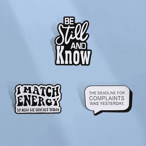 Three-piece set of black and white quote enamel pins with humorous and artistic texts