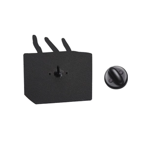 Macro view of the black matte enamel pin back with secure rubber clutch backing