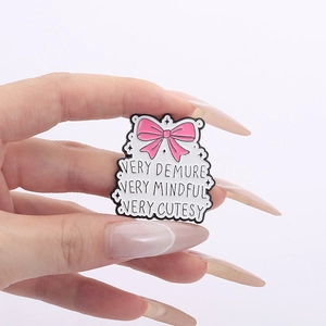 Pink bow enamel pin with Very Demure slogan, stylish badge for clothes and bags