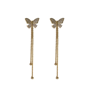 Elegant gold butterfly tassel earrings with shimmering crystals and hanging fine chains