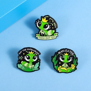 Detailed macro shot of three green cartoon mantis enamel pins with feminist slogans on blue base