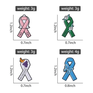 Detail showing colorful awareness ribbon enamel pins with specific symbols and engraved text