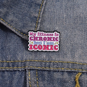 Inspirational enamel pin 'My illness is CHRONIC but I am ICONIC' on denim jacket