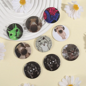 Flat lay of colorful tinplate badges featuring various cute cat and dog cartoon designs