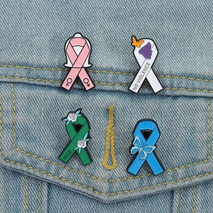 Set of four colorful enamel ribbon pins for mental health and social awareness on denim