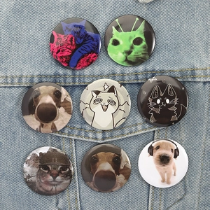Set of 8 cute cat and dog tinplate badges on denim jacket pocket with safety pins