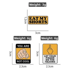 Detailed view of three funny enamel pins featuring sarcastic slogans and edgy hand gestures