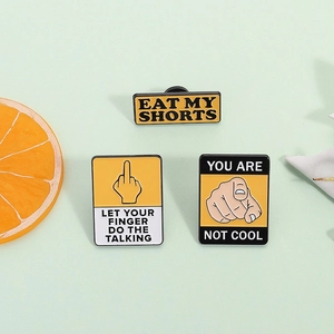 Funny cartoon enamel pin set with witty slogans and bold yellow and black graphics