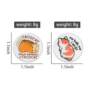 Detail of 1.1-inch Tacocat and Angy Cat enamel pins with 8g weight specification