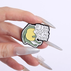 Funny green frog enamel pin badge with If I am Moody Give Me Foody humorous text