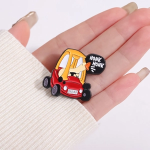 Detailed close-up of a cartoon duck driving a red tractor enamel pin held by hand