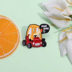 Funny enamel pin featuring a cartoon yellow duck driving a car with HONK HONK text bubbles
