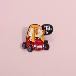 Detail of funny white duck enamel pin driving a toy car with Honk Honk text bubble