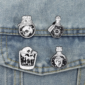 Gothic black and white enamel pins set featuring skull and heart magic potion bottles