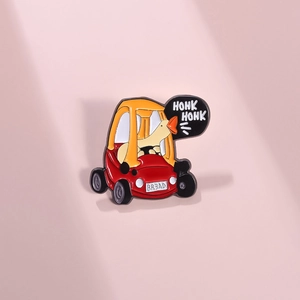 Cartoon duck driving a toy car enamel pin with Honk Honk text on a pink background